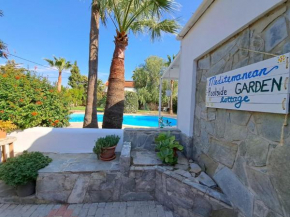 Mediterranean poolside garden cottage